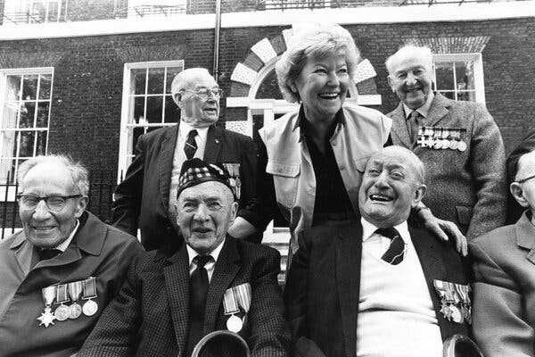 Lyn Macdonald with veterans of World War I on their way to visit battlefields in France in 1983. “My intention,” she said, “has been to tune in to the heartbeat of the experience of the people who lived through” the war.